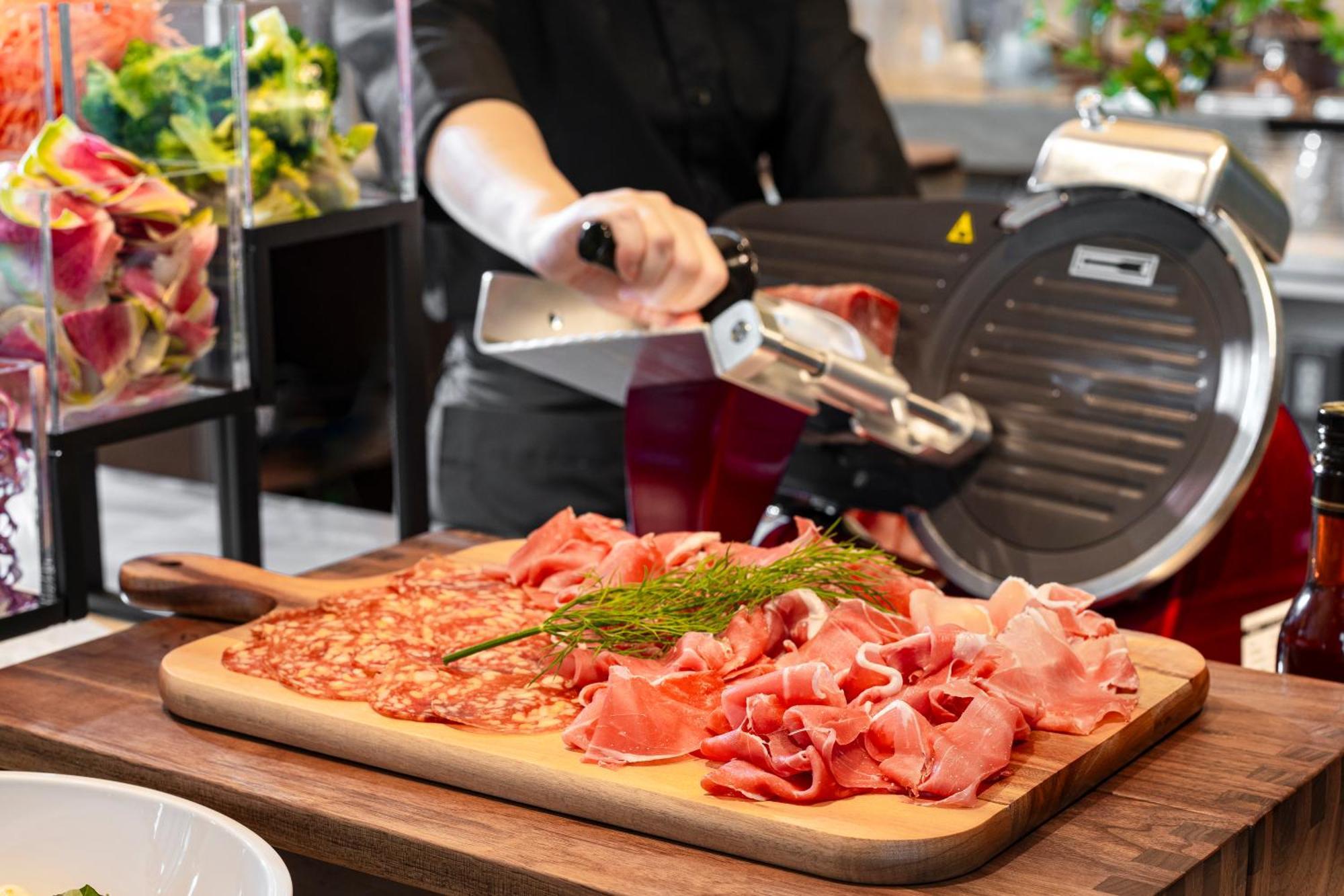 Candeo Hotels Osaka The Tower Экстерьер фото A deli slicer in action